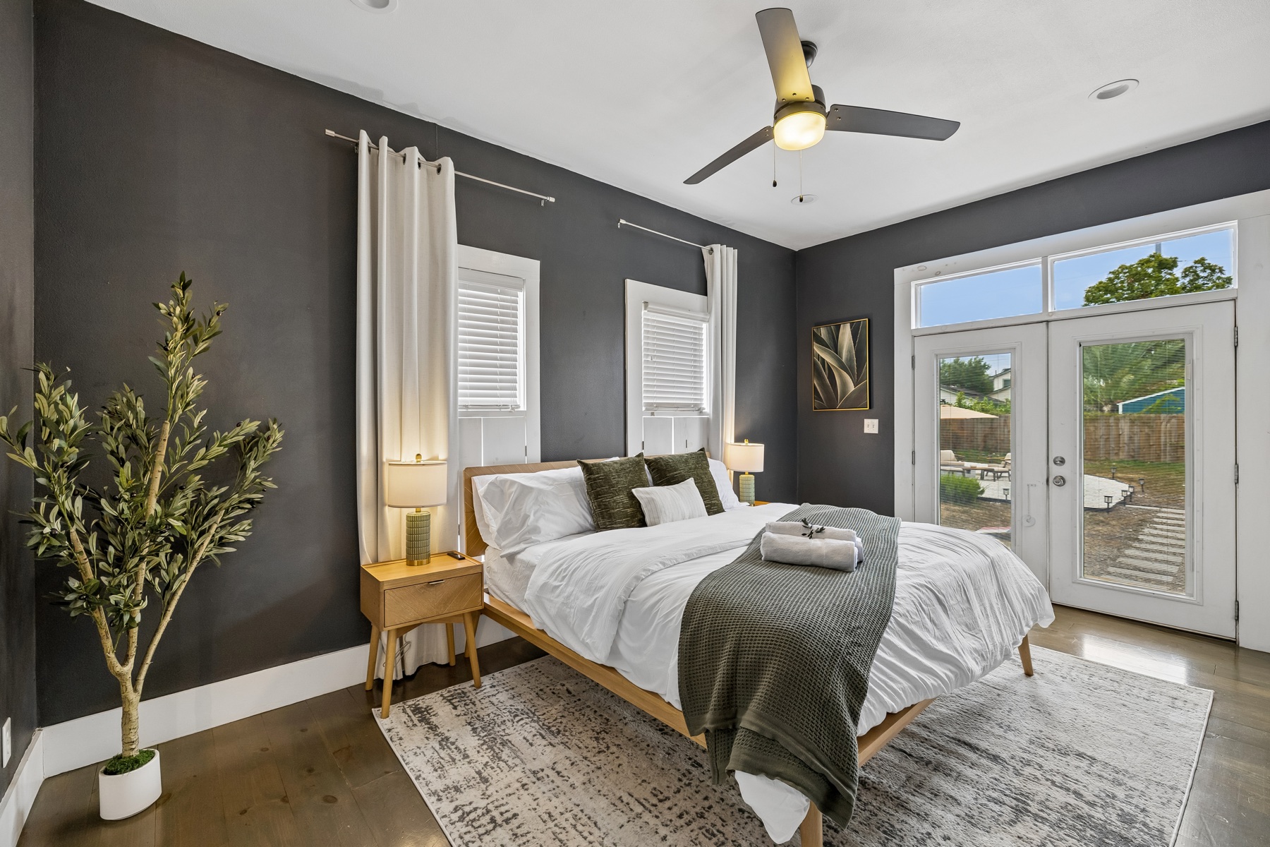 Oasis at the Alamo master bedroom with a king bed and garden doors